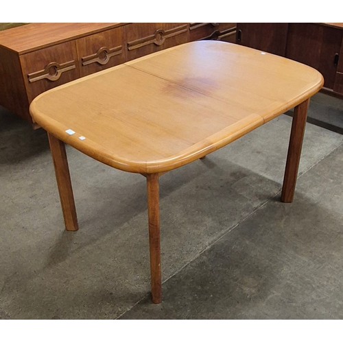 60 - A Danish teak extending dining table