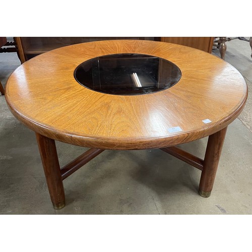 62 - A G-Plan teak and glass topped circular coffee table