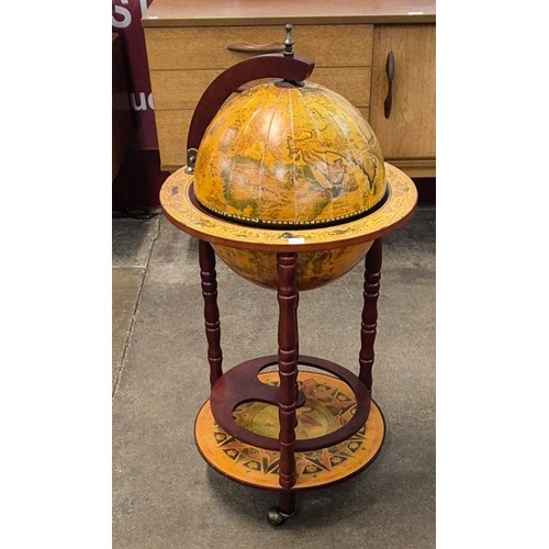 67 - An Italian style terrestrial globe cocktail cabinet/trolley