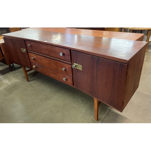 68 - A teak and afromosia concave sideboard