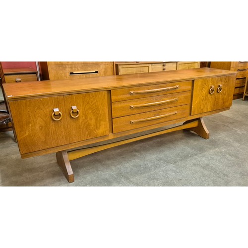 95 - A teak bowfront sideboard