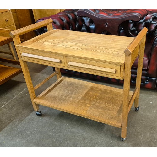 98 - An oak and ash two drawer trolley