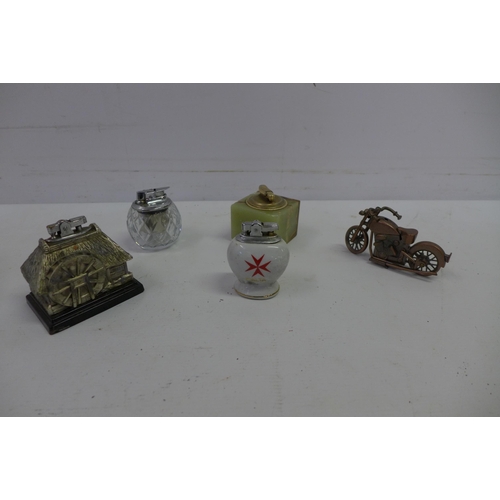 2052 - 5 decorative table lighters including a motorcycle and 4 others