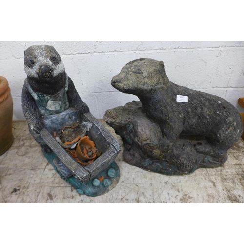 2246 - Two concrete badger garden ornaments