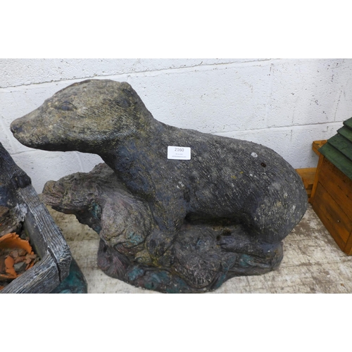 2246 - Two concrete badger garden ornaments