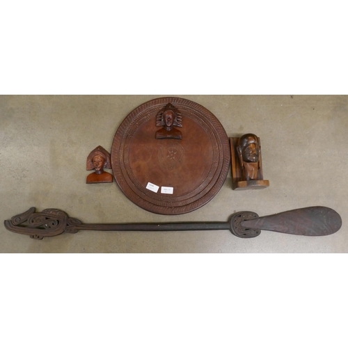 1143 - Carved wooden pieces from Papua New Guinea including a table top and a paddle **PLEASE NOTE THIS LOT... 