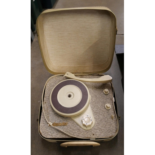 1157 - A Westminster suitcase record player with a box of 7