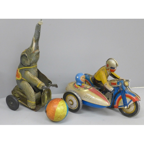 629 - Two tin-plate clockwork toys