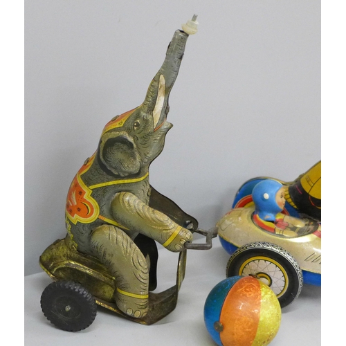 629 - Two tin-plate clockwork toys