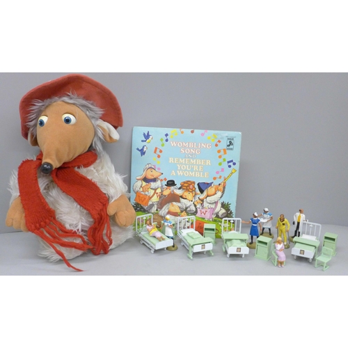 640 - A Britains hospital set, a soft toy Womble and a Wombling 45rpm record