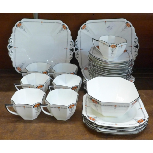 653 - A 1920s Shelley tea set, seven cups, one a/f, twelve saucers, eleven side plates, a bowl, a/f, and t... 