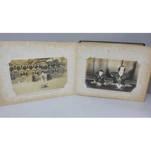 666 - Three albums of 112 early 20th century Japanese postcards and black and white photographs including ... 