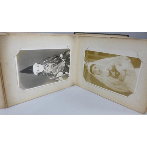 666 - Three albums of 112 early 20th century Japanese postcards and black and white photographs including ... 