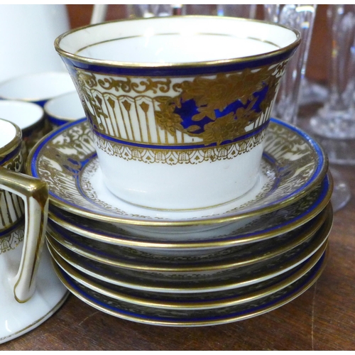 676 - A Noritake coffee set with blue and gilt decoration, six saucers, five coffee cans, a sugar bowl, mi... 