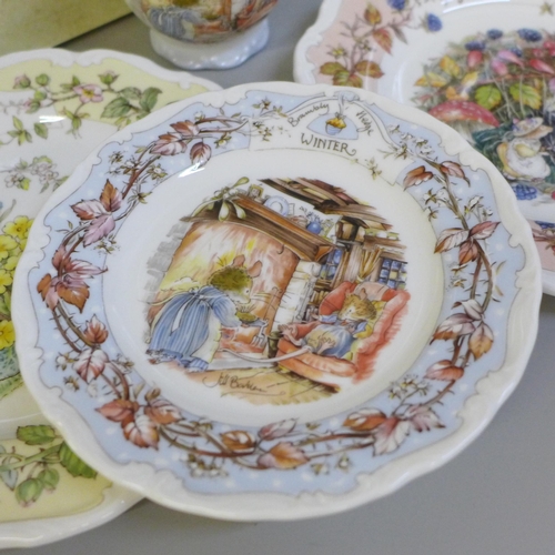 748 - Four Royal Doulton Brambly Hedge Season plates and one cup and two Brambly Hedge books