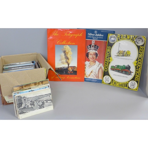 764 - A box of assorted postcards and three albums of railway collectors cards