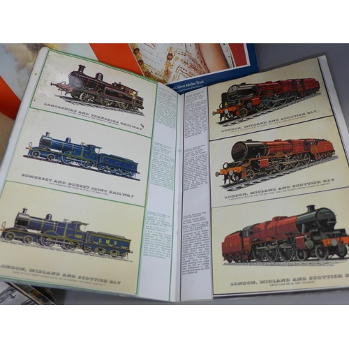 764 - A box of assorted postcards and three albums of railway collectors cards