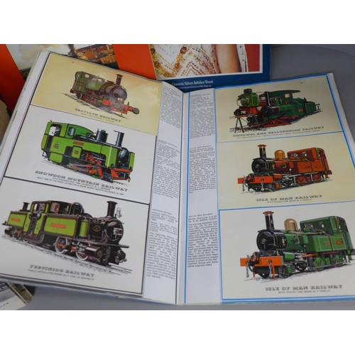 764 - A box of assorted postcards and three albums of railway collectors cards