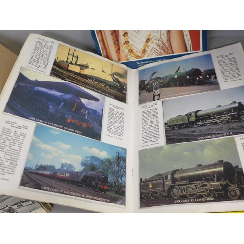 764 - A box of assorted postcards and three albums of railway collectors cards