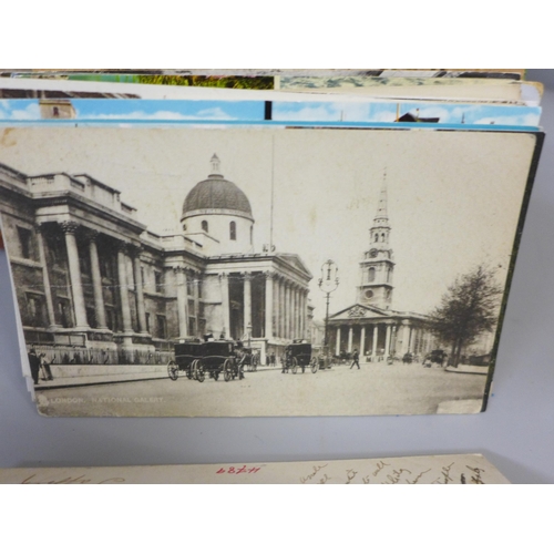 764 - A box of assorted postcards and three albums of railway collectors cards