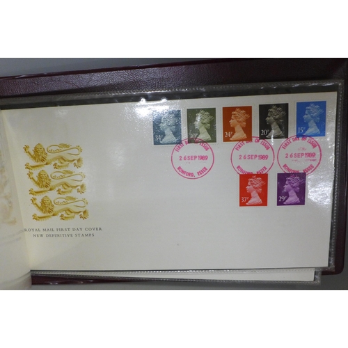 769 - Stamps; two albums of first days covers, a replica penny black stamp set and a Royal Mail identity c... 