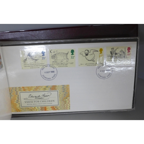 769 - Stamps; two albums of first days covers, a replica penny black stamp set and a Royal Mail identity c... 