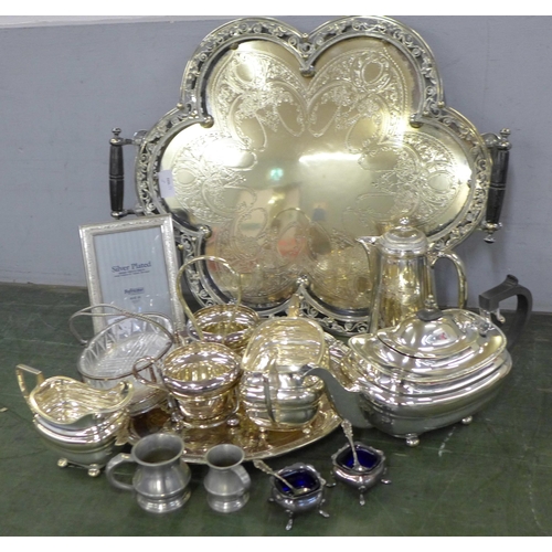 774 - A collection of silver plated ware, including a large decorative two handled tray, a coffee pot, tea... 