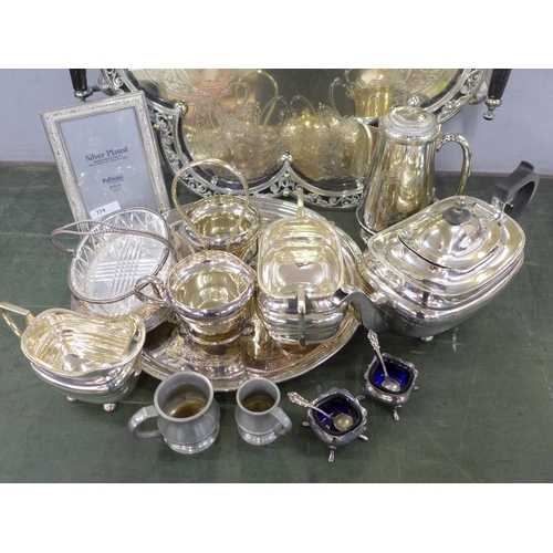 774 - A collection of silver plated ware, including a large decorative two handled tray, a coffee pot, tea... 