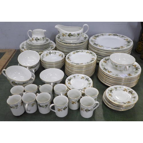 776 - A Royal Doulton Larchmont dinner service, with a coffee set, soup bowls and sugar bowl, etc., over 1... 