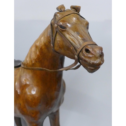 785 - A brown leather model of a horse, height 49cm