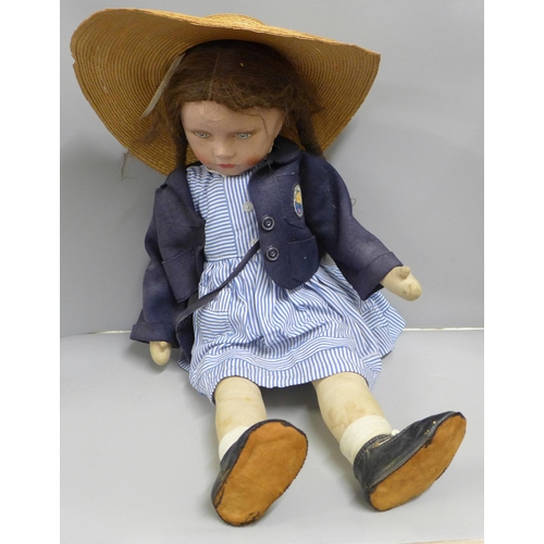 801 - A large 1940s composition doll in school uniform, cloth body, 60cm