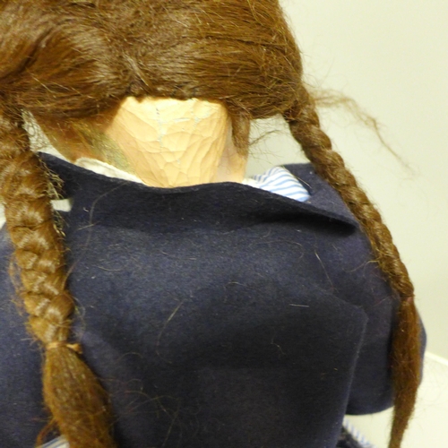 801 - A large 1940s composition doll in school uniform, cloth body, 60cm