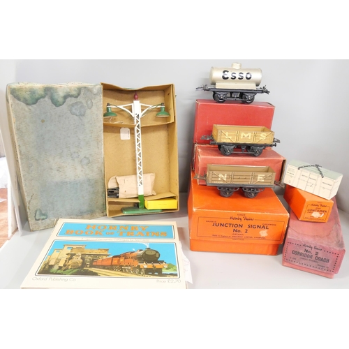 802 - A box of Hornby O gauge tinplate wagons, accessories, boxes and a 'Hornby Book of Trains' reprint of... 