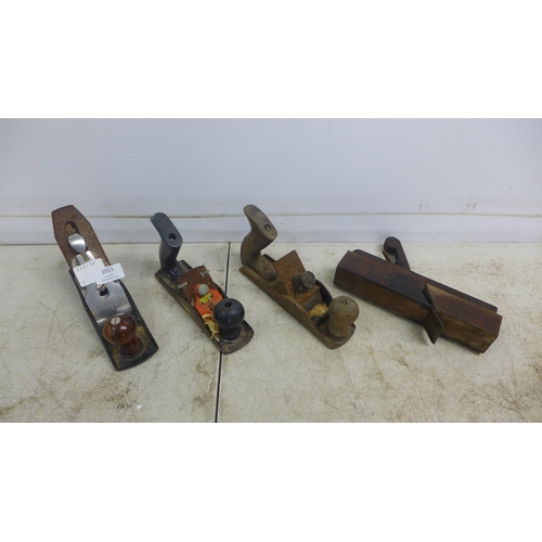 2013 - Three vintage wood planes including a Stanley SB3, a No.3 plane and one other, a molding plane, a Nu... 