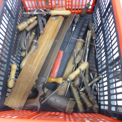 2022 - A large assortment of vintage tools including hand drills, mallets, a saw, brace drill, files, spiri... 