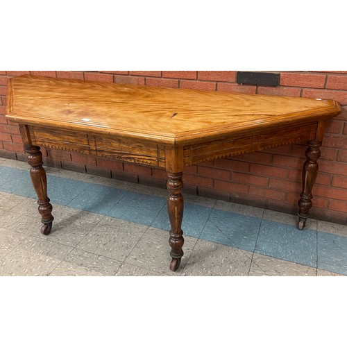 232 - A Victorian Aesthetic Movement walnut serving table