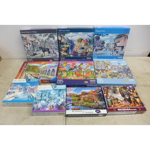 2063 - A box of ten assorted jigsaw puzzles