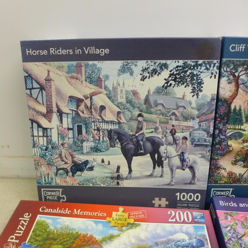 2063 - A box of ten assorted jigsaw puzzles