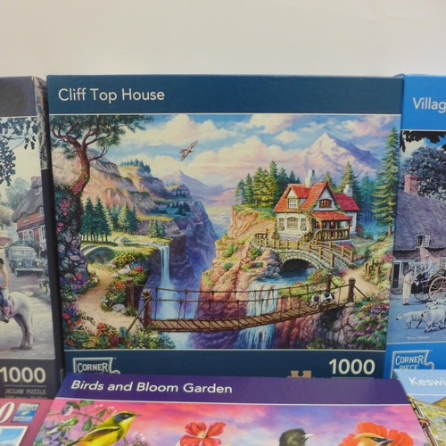 2063 - A box of ten assorted jigsaw puzzles