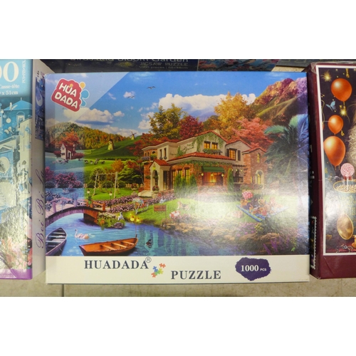 2063 - A box of ten assorted jigsaw puzzles