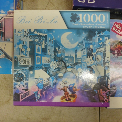 2063 - A box of ten assorted jigsaw puzzles