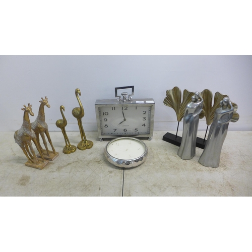 2066 - An assortment of table ornaments, a candle and metal mantel clock