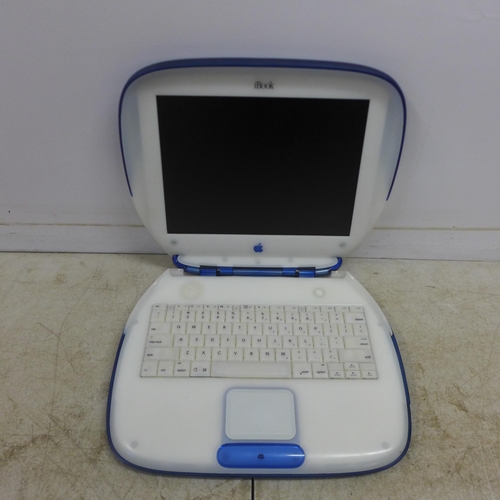 2078 - An Apple iBook model M6411 portable laptop with charging cable