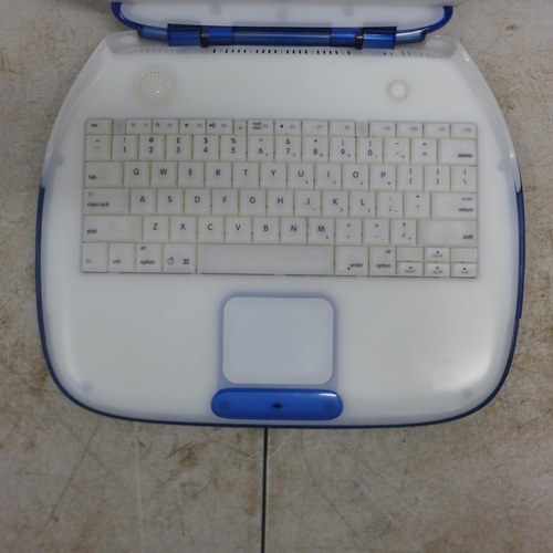 2078 - An Apple iBook model M6411 portable laptop with charging cable