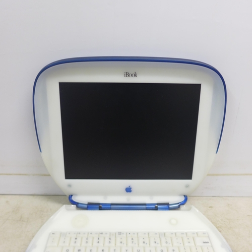 2078 - An Apple iBook model M6411 portable laptop with charging cable