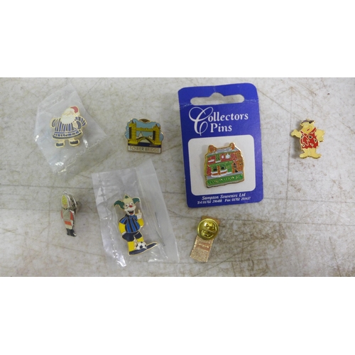 2081A - 75 pin badges including Simpsons, Santa, football and London landmarks