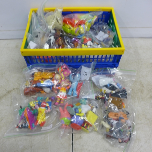 2088 - A small crate of bagged mixed toy figures - Night Garden, McDonalds toys, farmyard animals, etc.