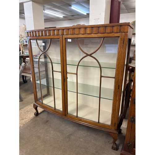 244 - An early 20th Century oak display cabinet