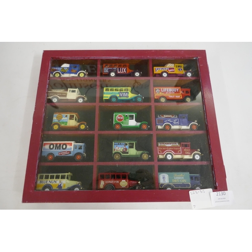 2130 - 15 collector model cars in a wooden display unit