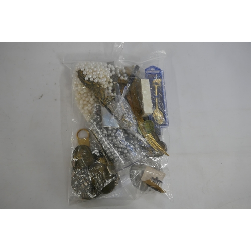 2134 - Two bags of costume jewelry and and 5 collectible perfume bottles